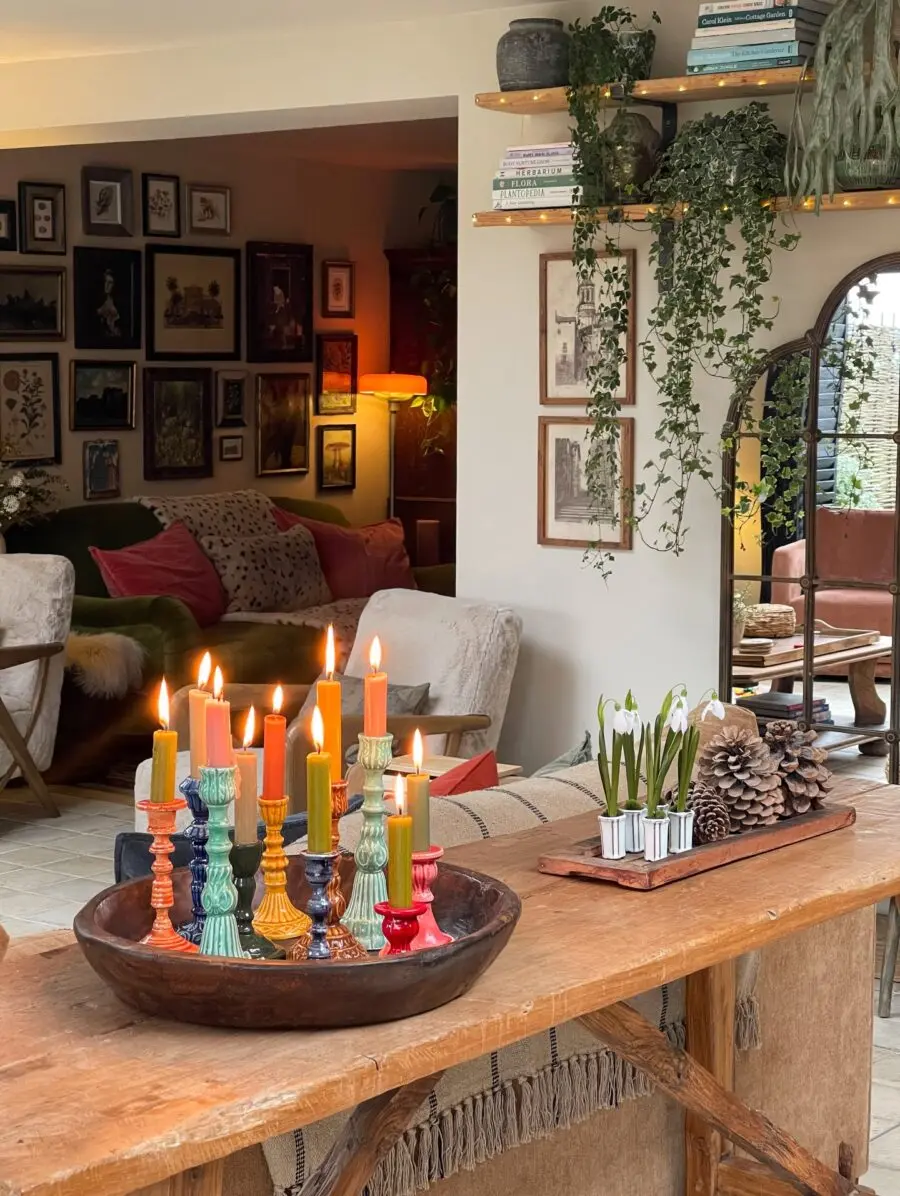 Colorful candle arrangement in eclectic living space