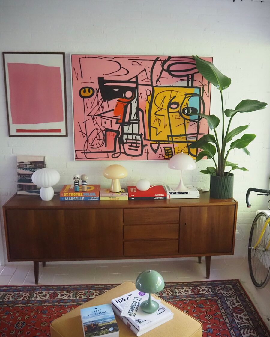 Vibrant art paired with mid-century furniture styles