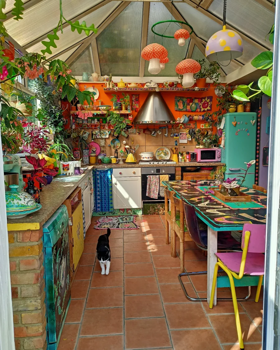 Vibrant eclectic kitchen filled with plants