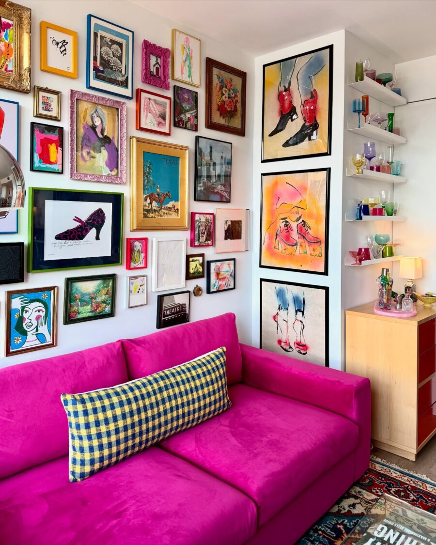 Vibrant walls showcase stunning eclectic art collection.