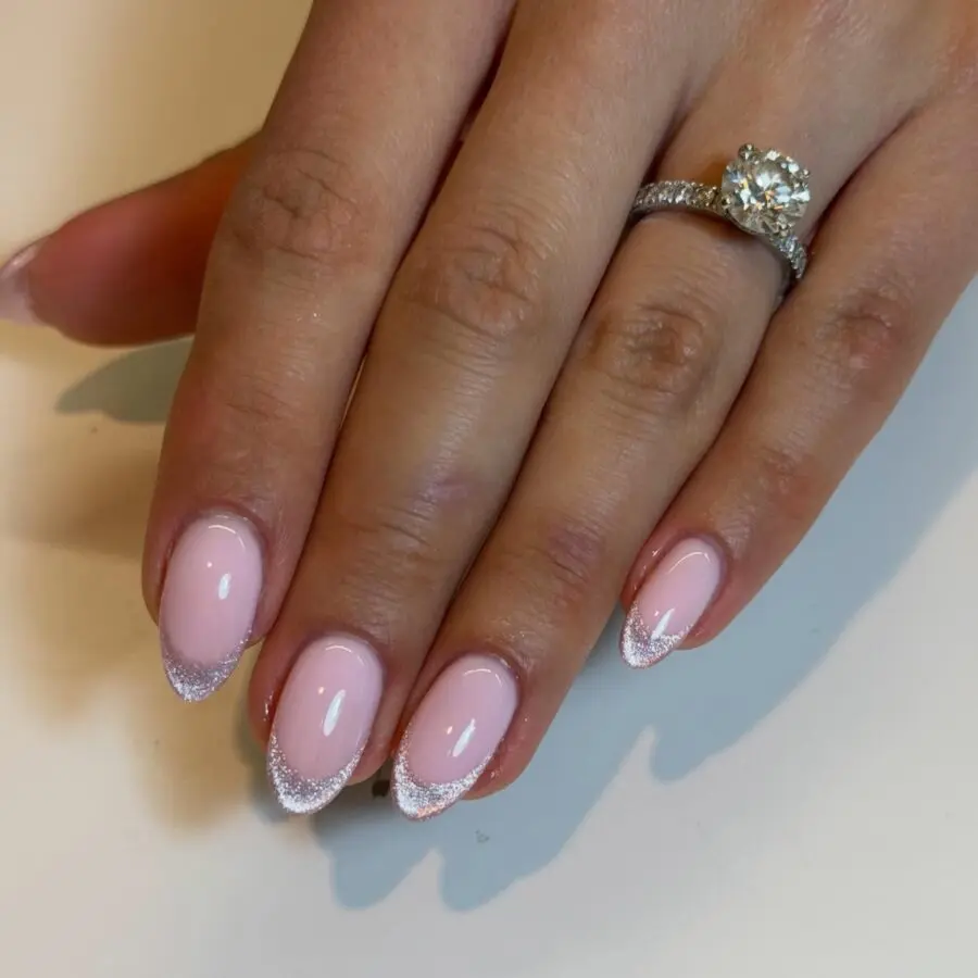 Chic French tips with a sparkling twist