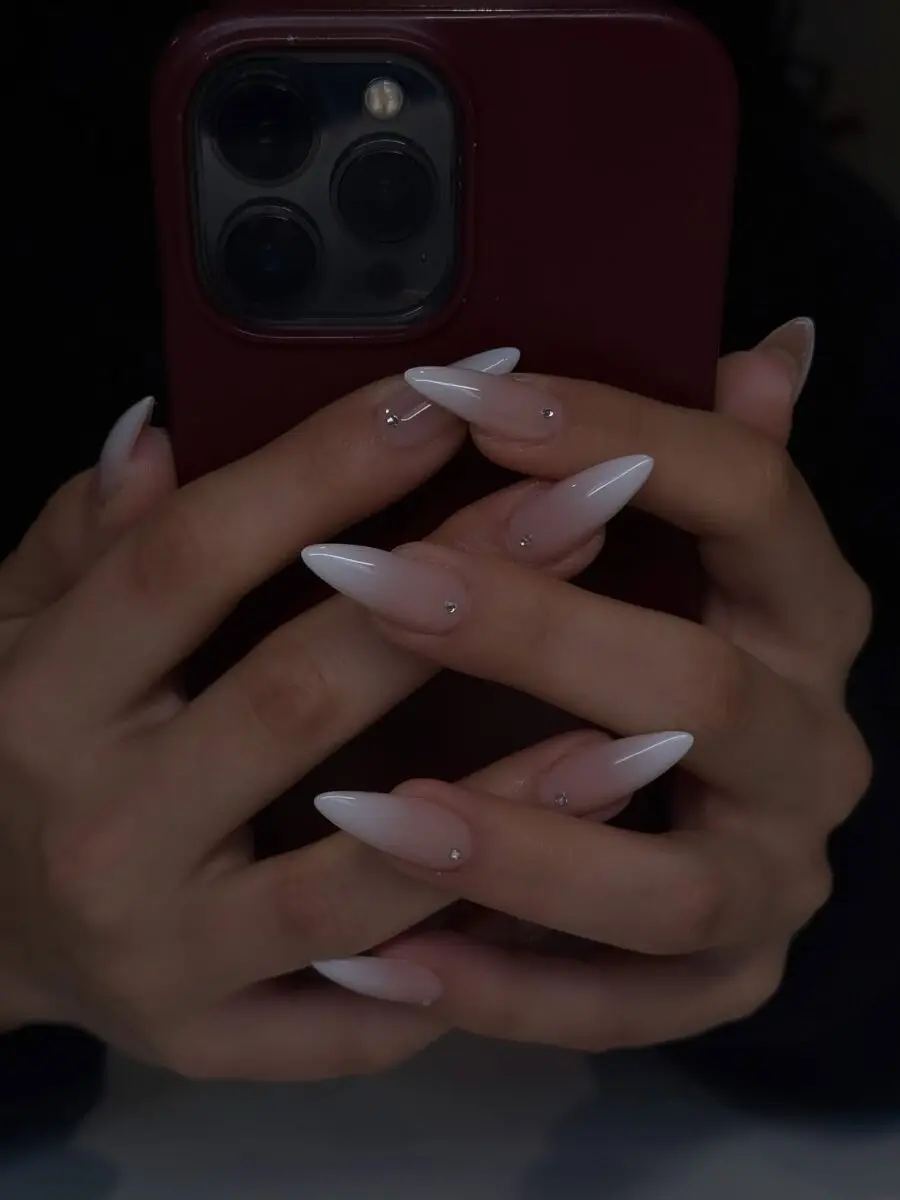 Chic stiletto nails with elegant bling accents