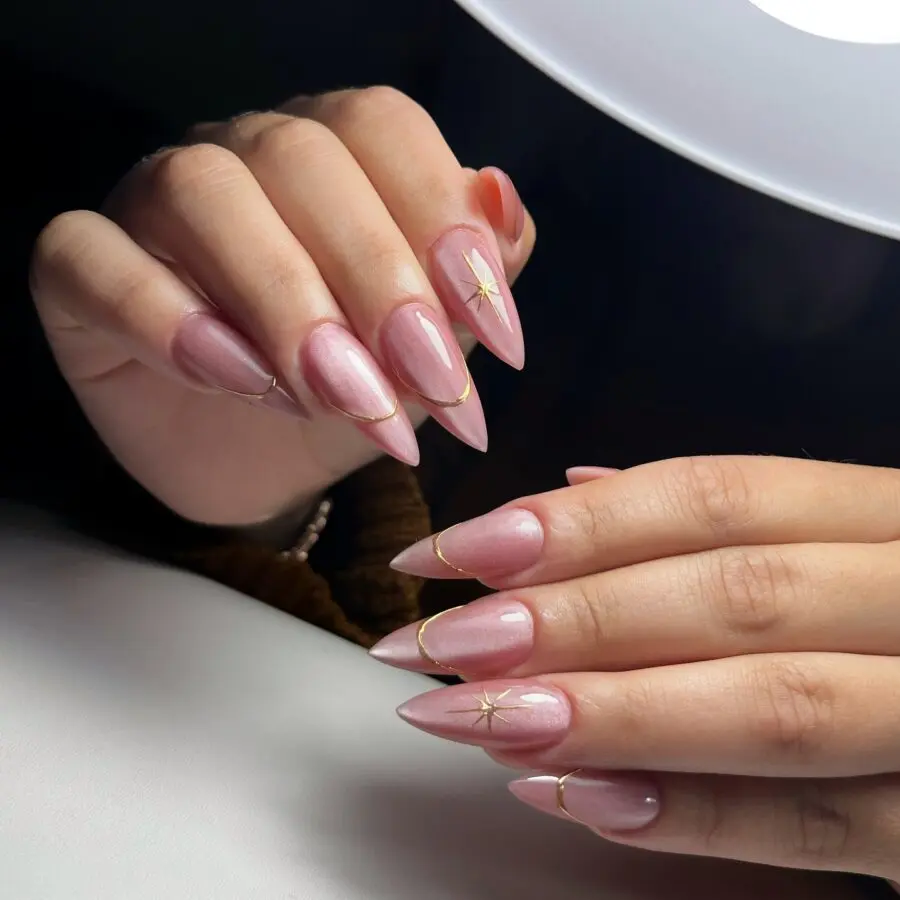 Chic stiletto nails with subtle gold accents