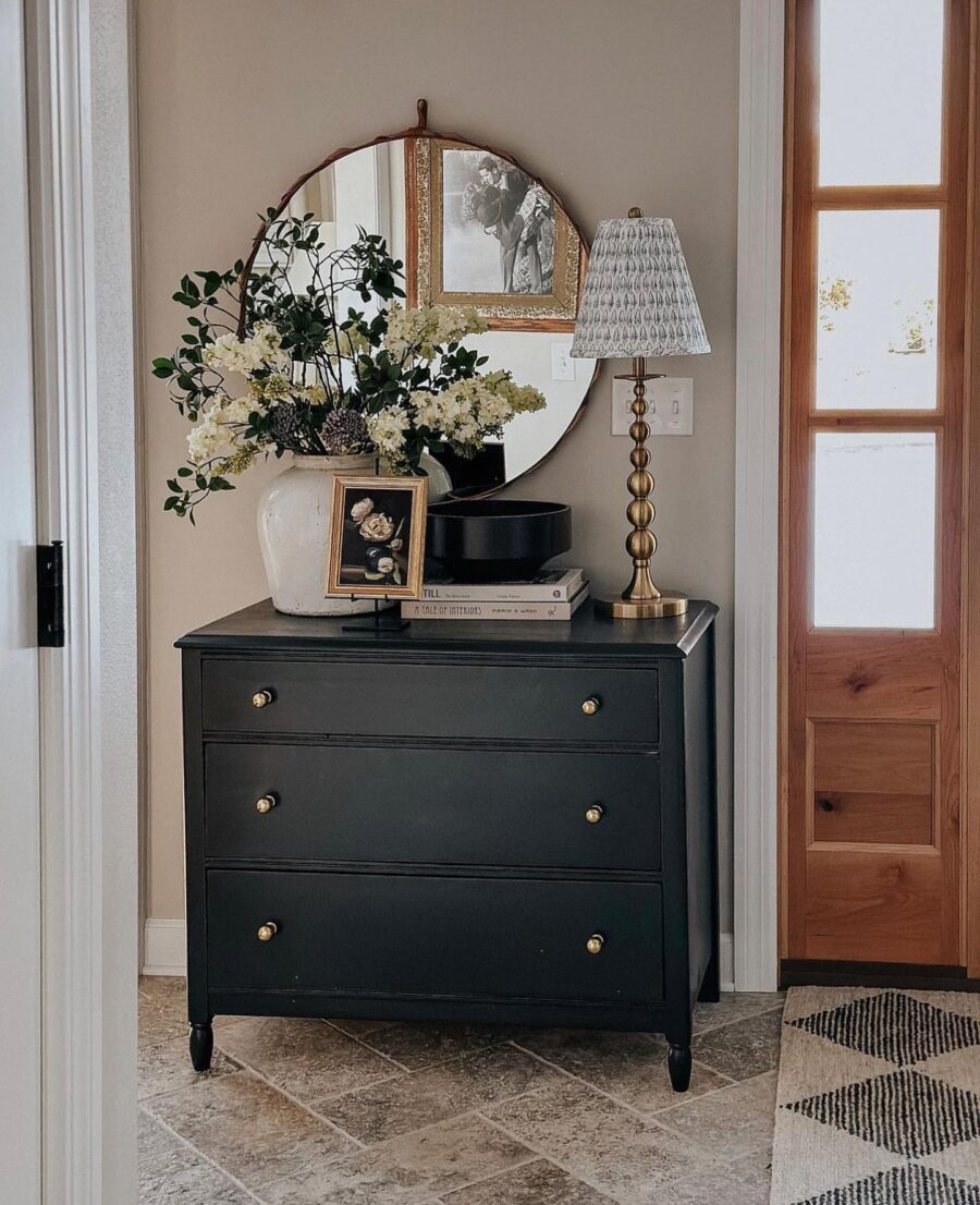 Chic black entryway table with floral accents
