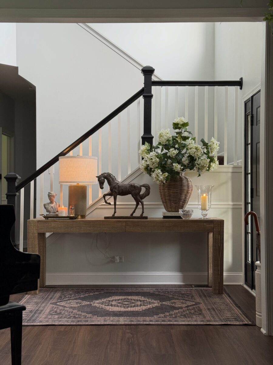 Elegant rustic entryway table with horse decor