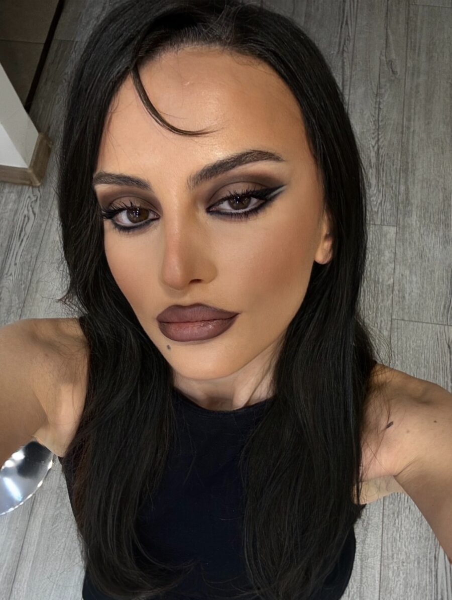 Dramatic eye makeup with bold lip choice