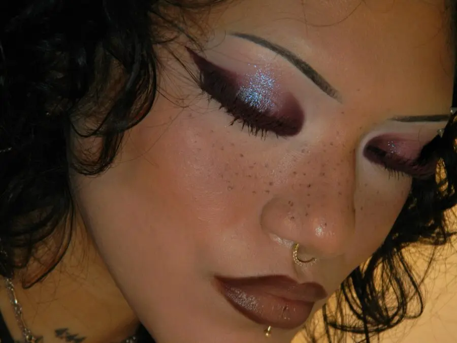 Glamorous dark lips with shimmering accents