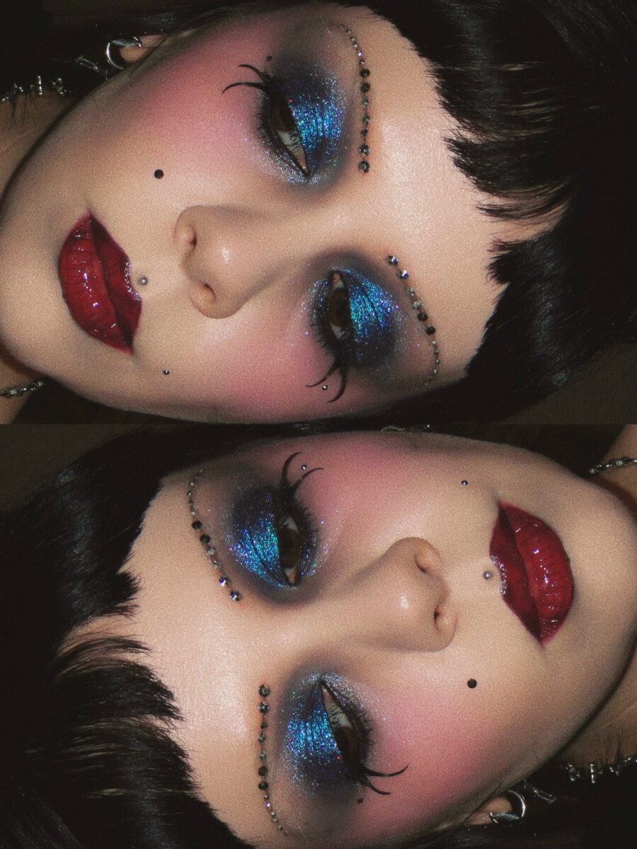 Bold blue sparkle with dramatic red lips