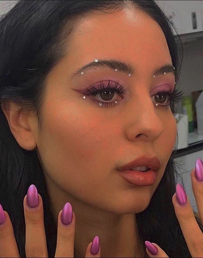 Vibrant purple euphoria makeup with bold accents