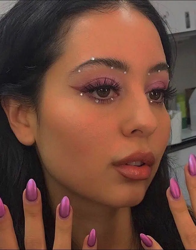 Vibrant purple euphoria makeup with bold accents