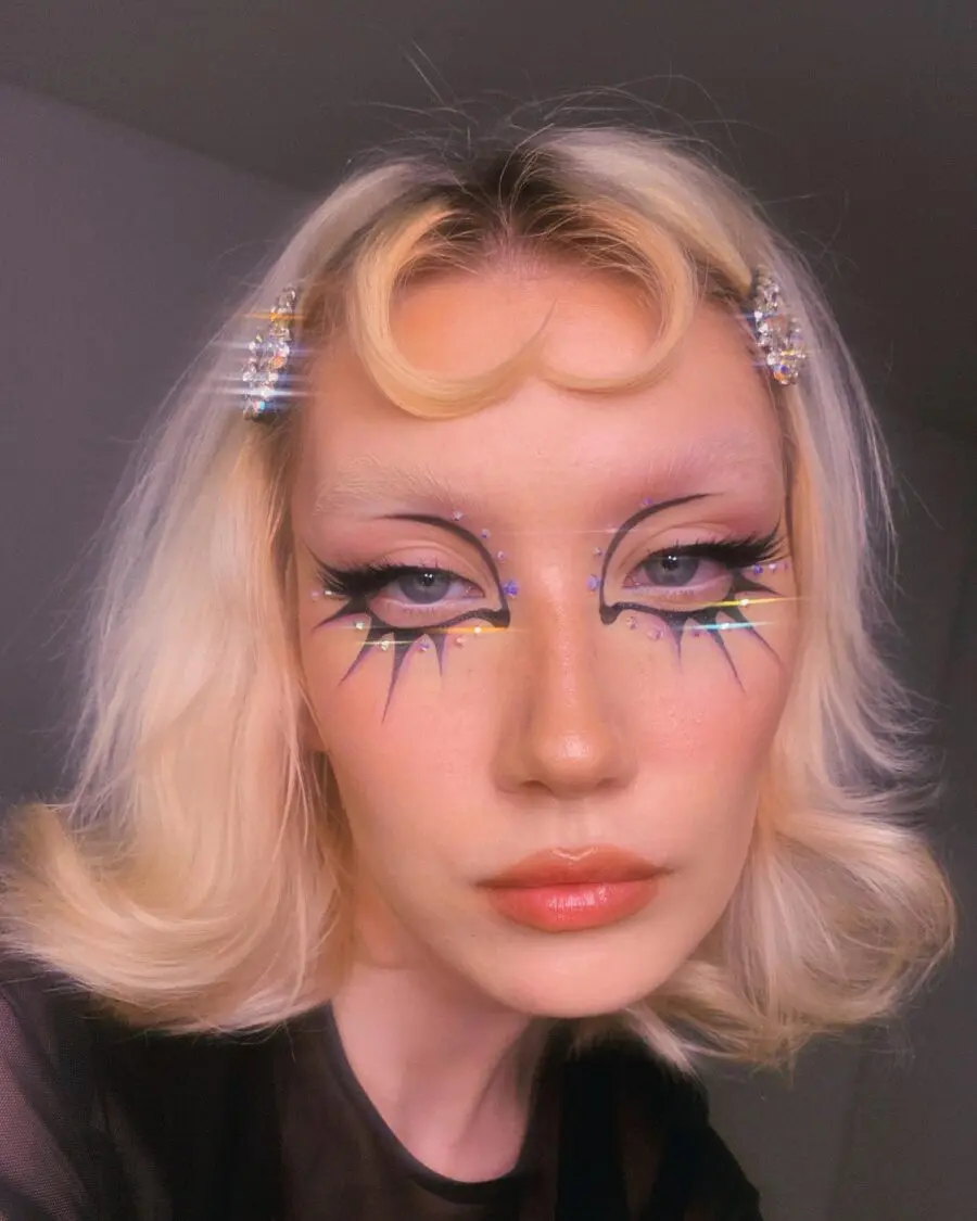 Bold starburst design for glamorous euphoria makeup