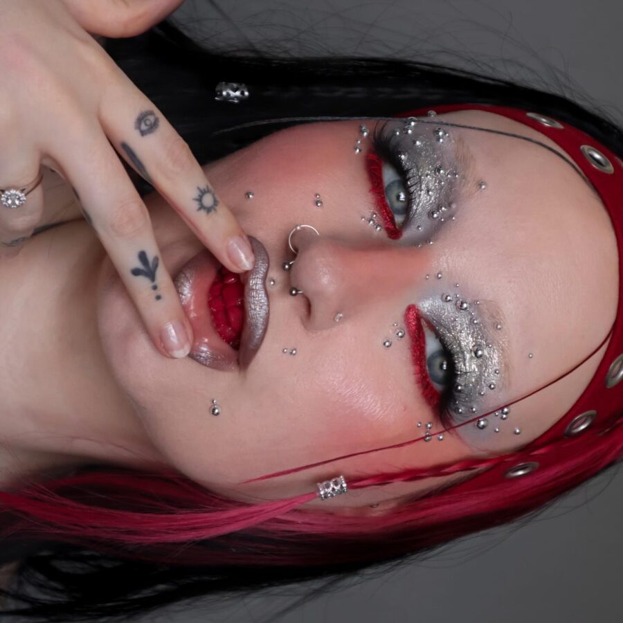 Bold red and silver euphoria makeup look