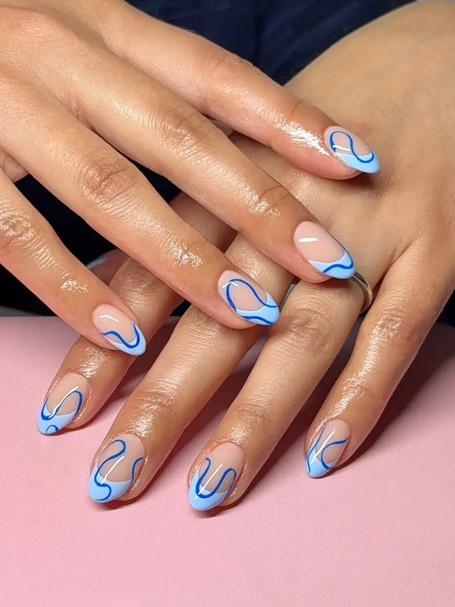 Stylish French Tip Acrylic Nails with Blue Flair