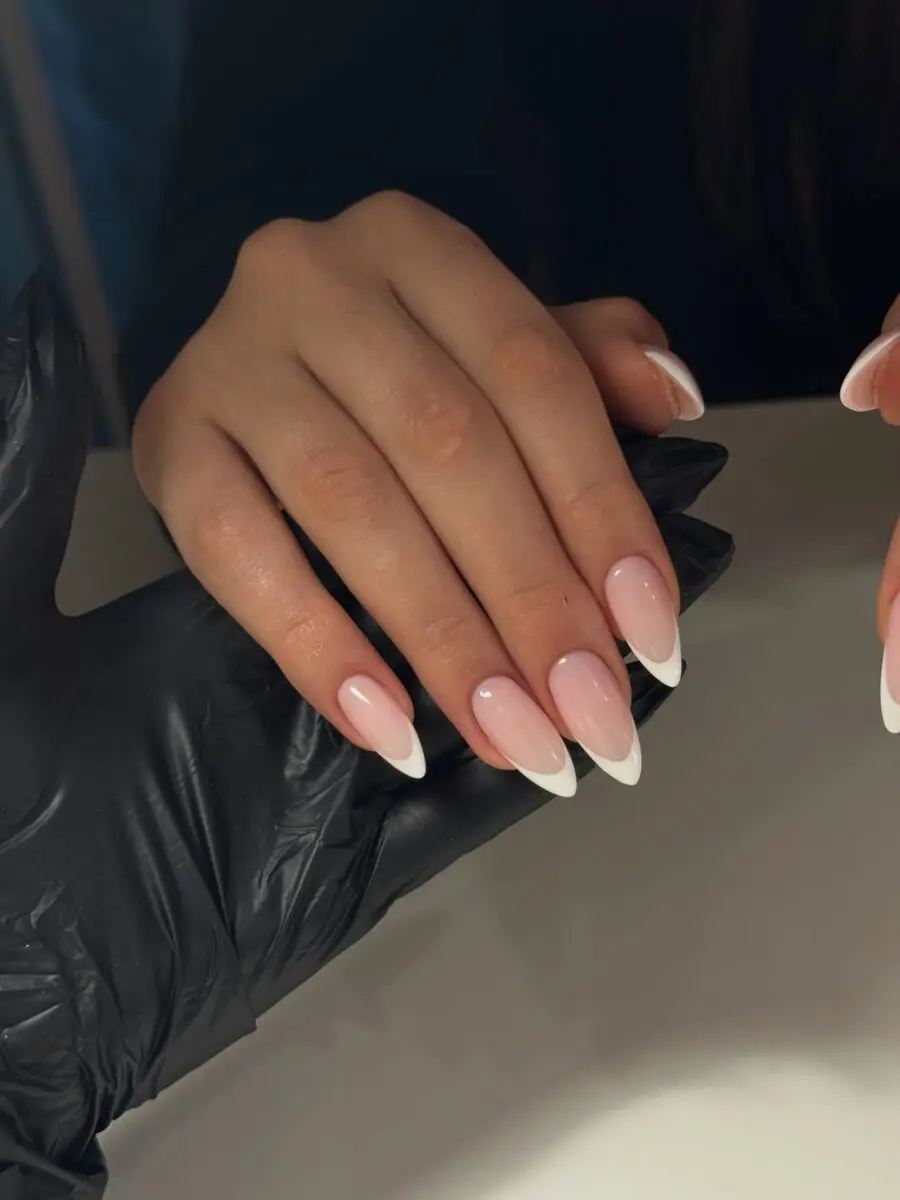 Elegant French Tip Acrylic Nails on Display