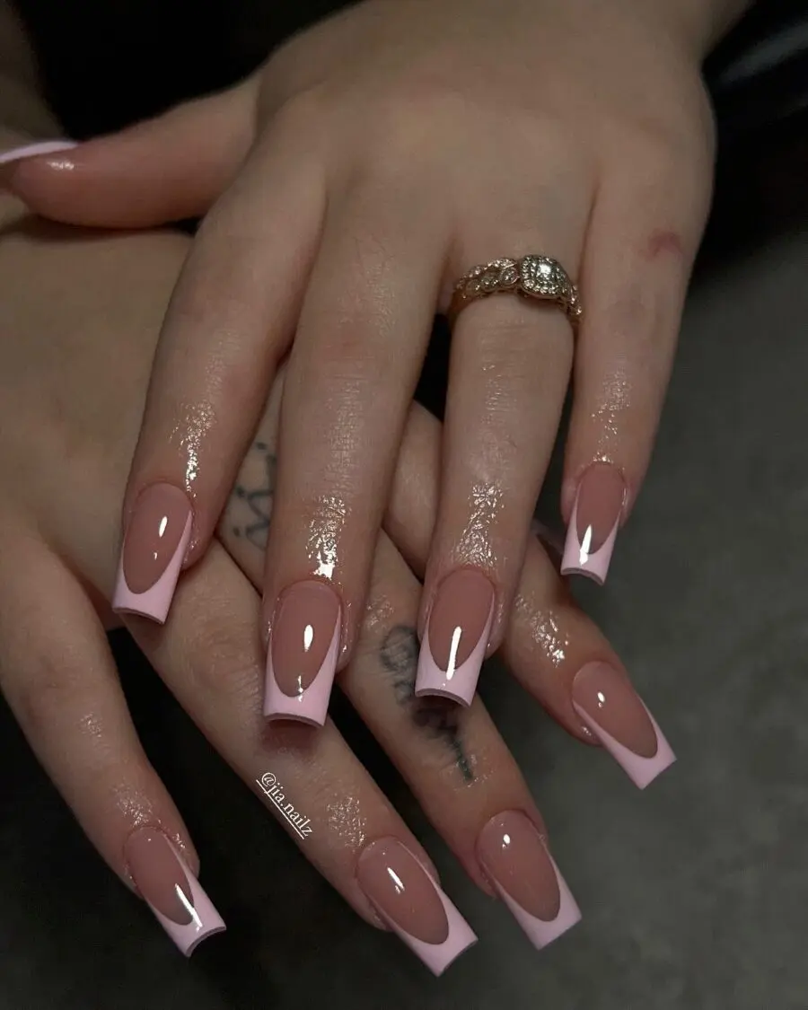 Elegant pink French tip acrylic nails showcased