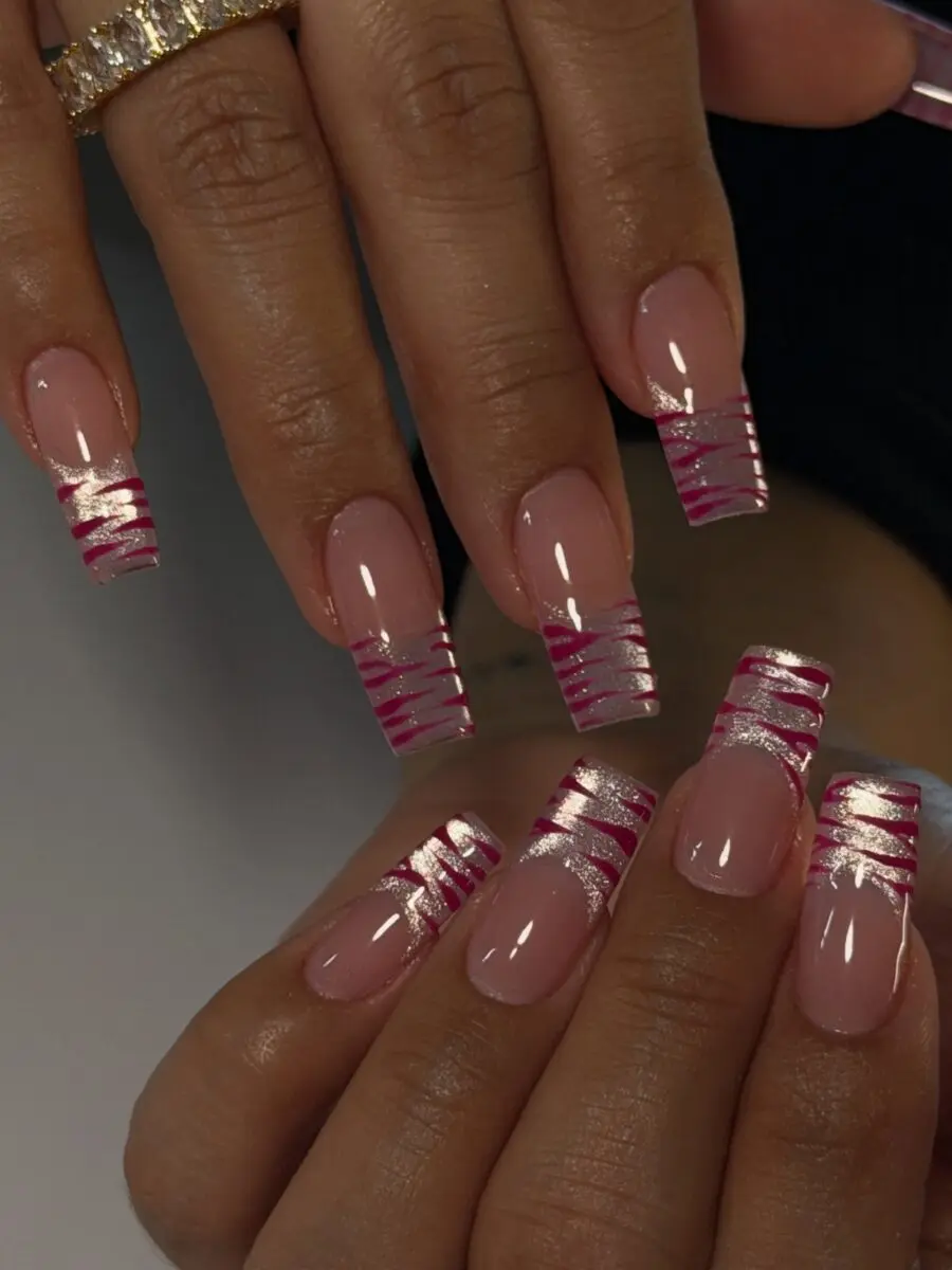 Stylish pink swirl French tip acrylic nails