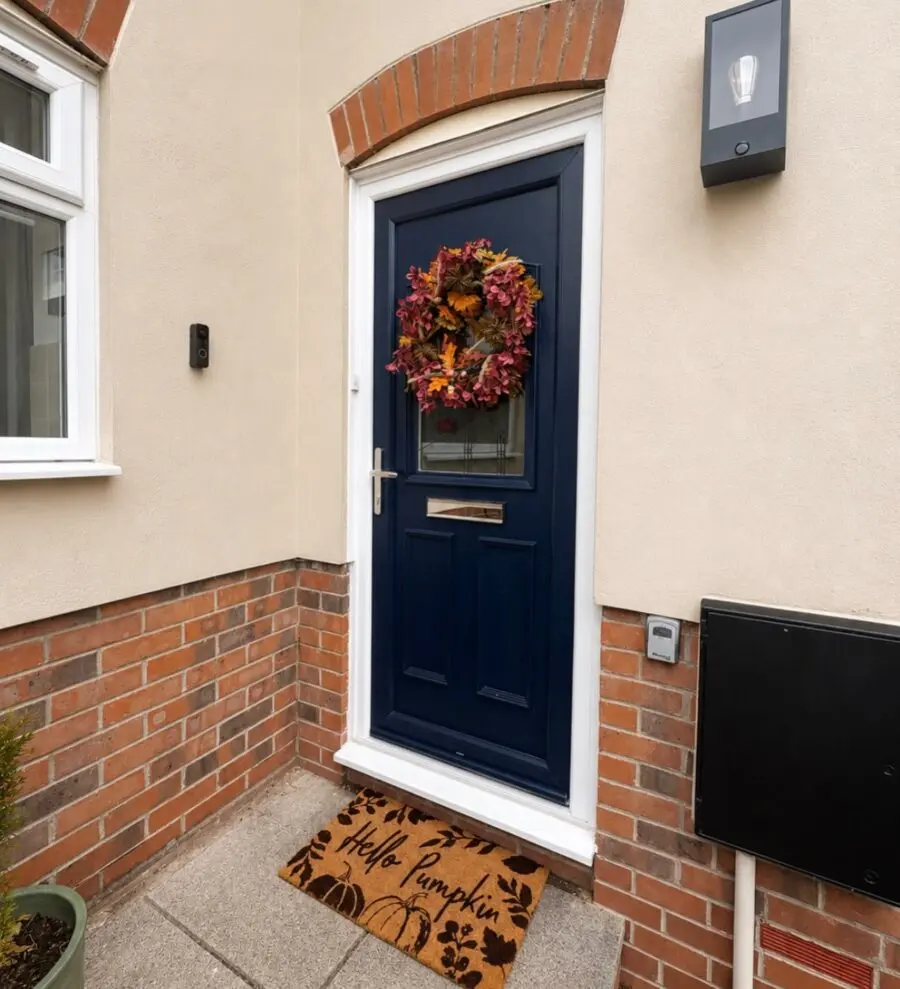Charming Entry with Fall Wreath and Mat