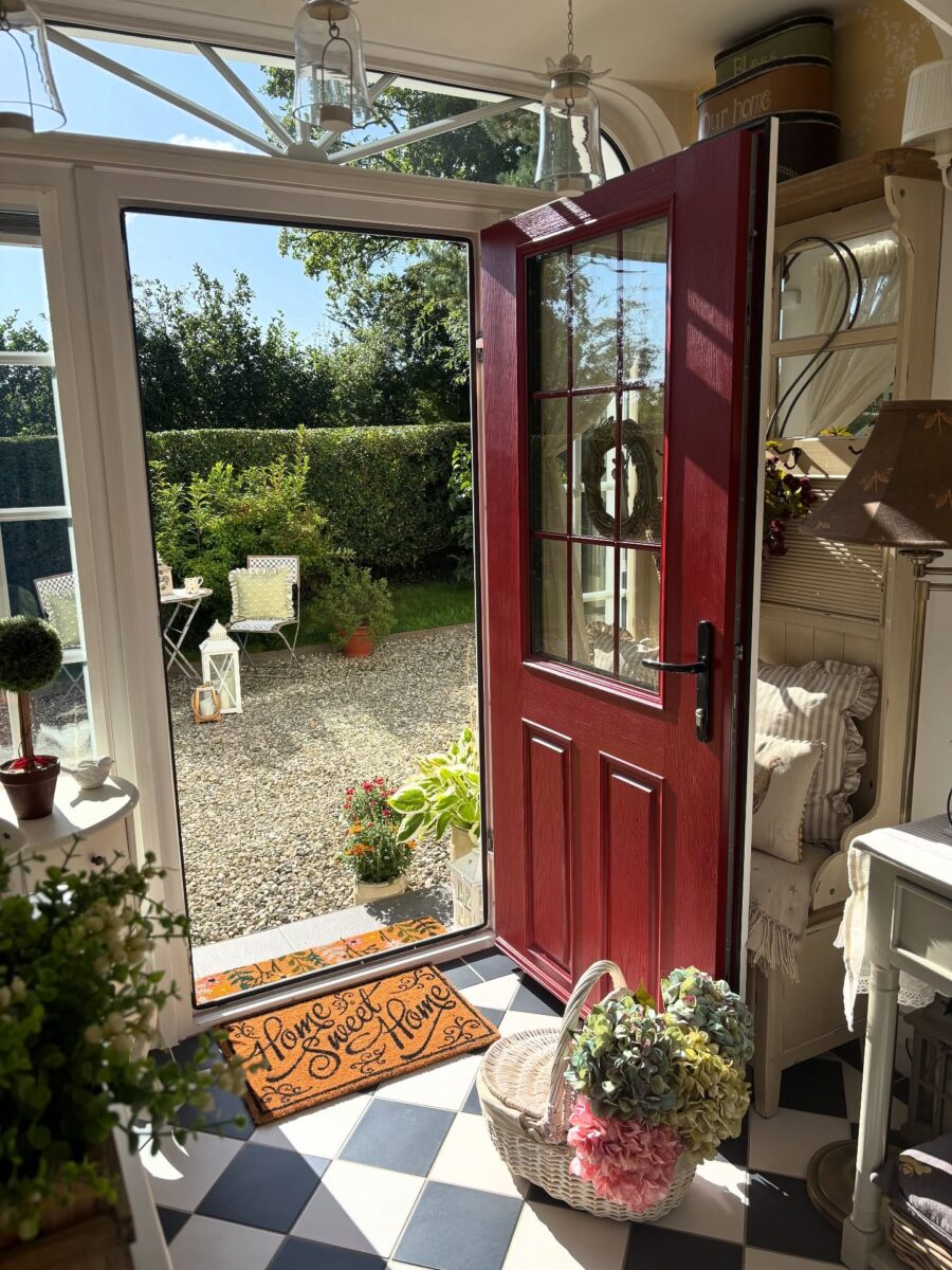 Charming entry with vibrant red door style