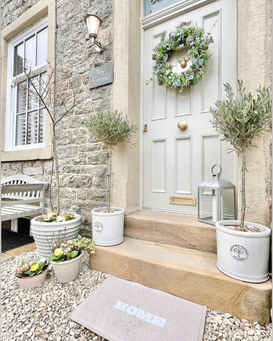 Charming front door decor with a welcoming wreath