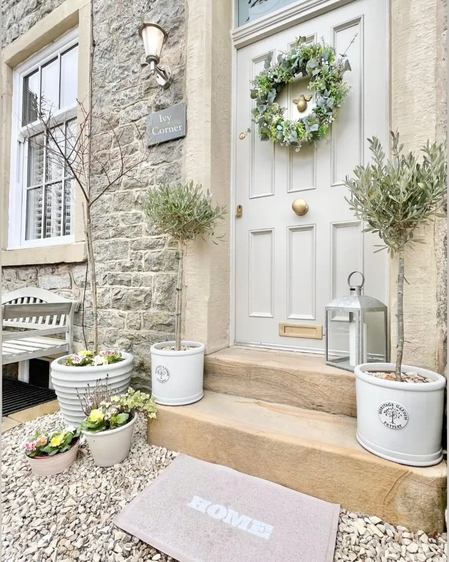 Charming front door decor with a welcoming wreath