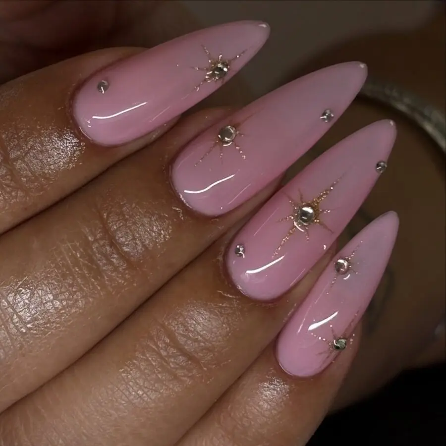 Glamorous Pink Stiletto Nails with Star Accents