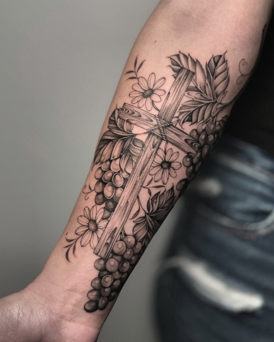 Elegant cross with grapes and flowers tattoo