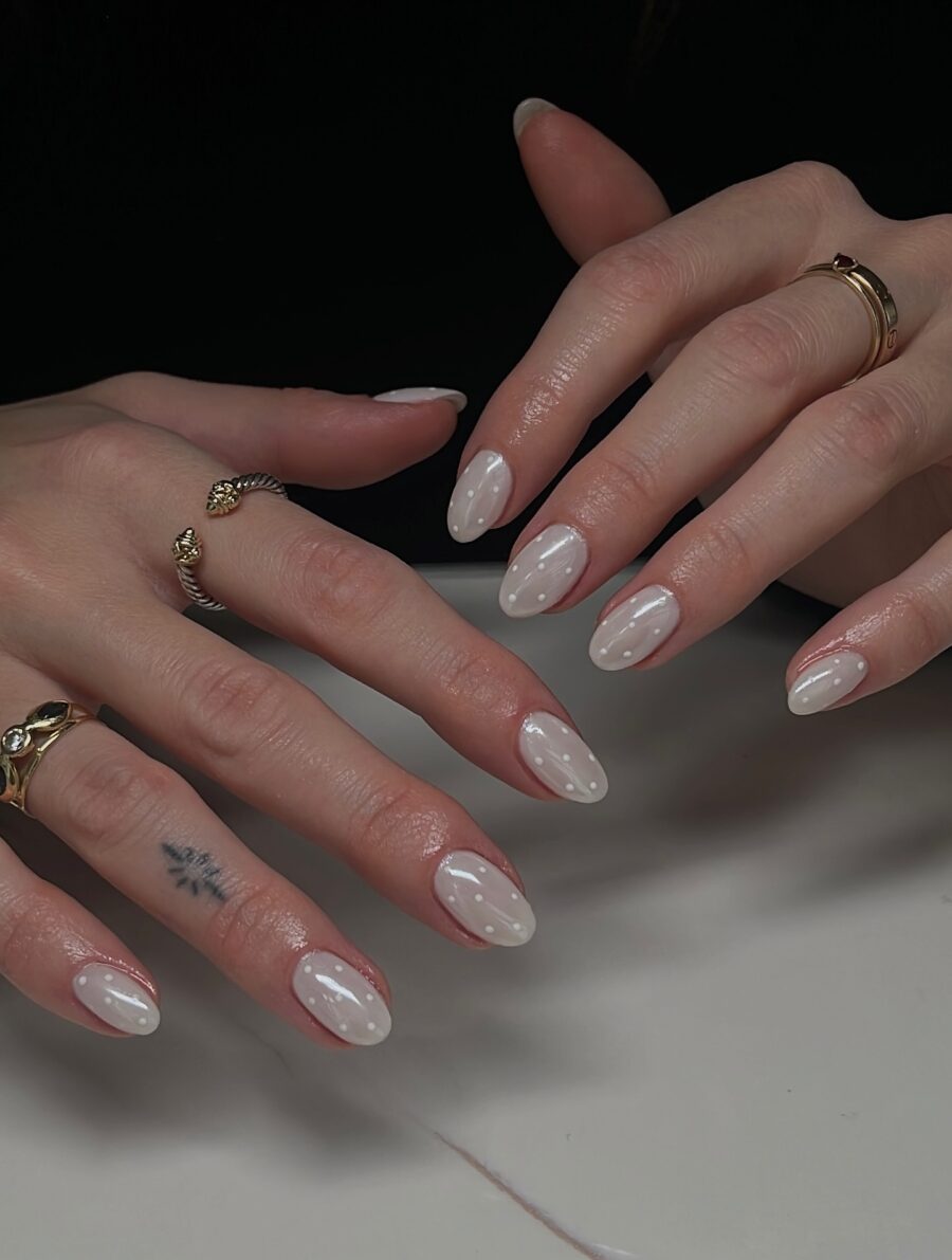 Elegant white oval nails with chic designs