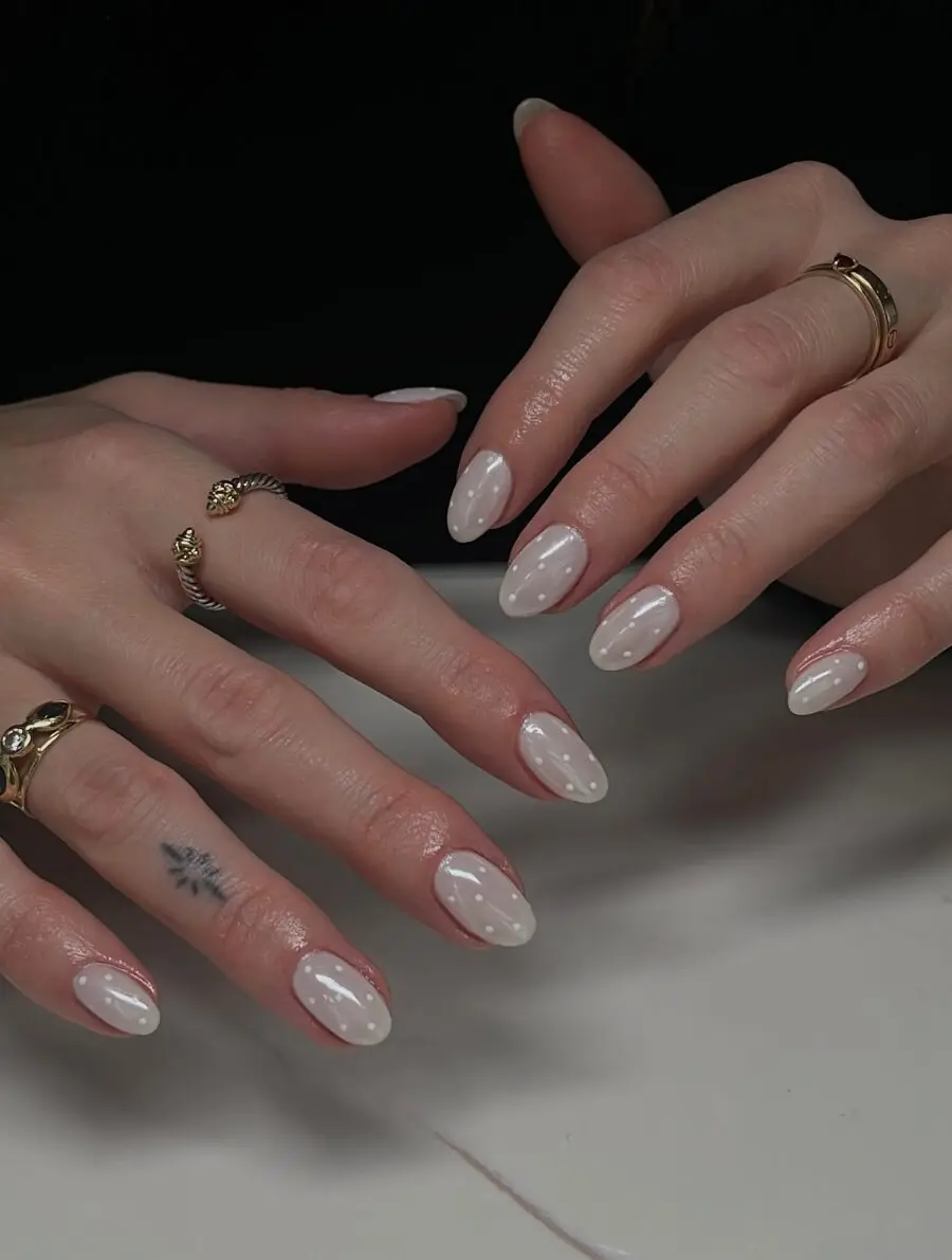 Elegant white oval nails with chic designs