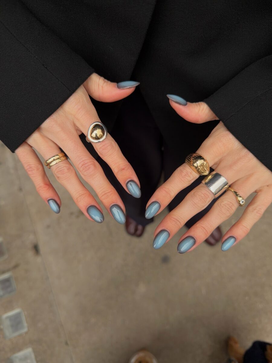 Chic matte blue nails with elegant rings
