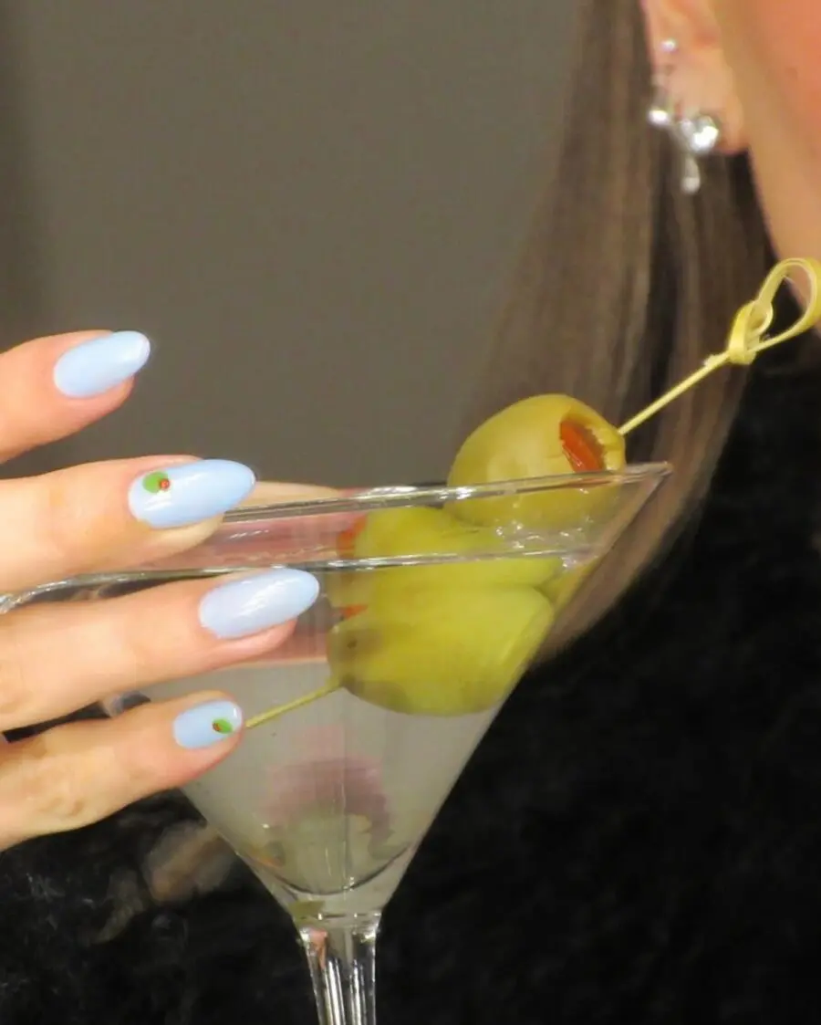 Chic blue nails with playful olive art