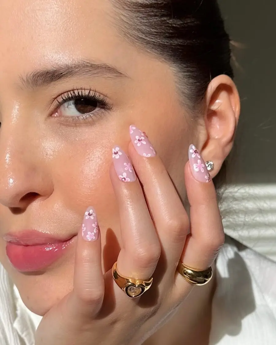 Chic pink nails adorned with floral designs