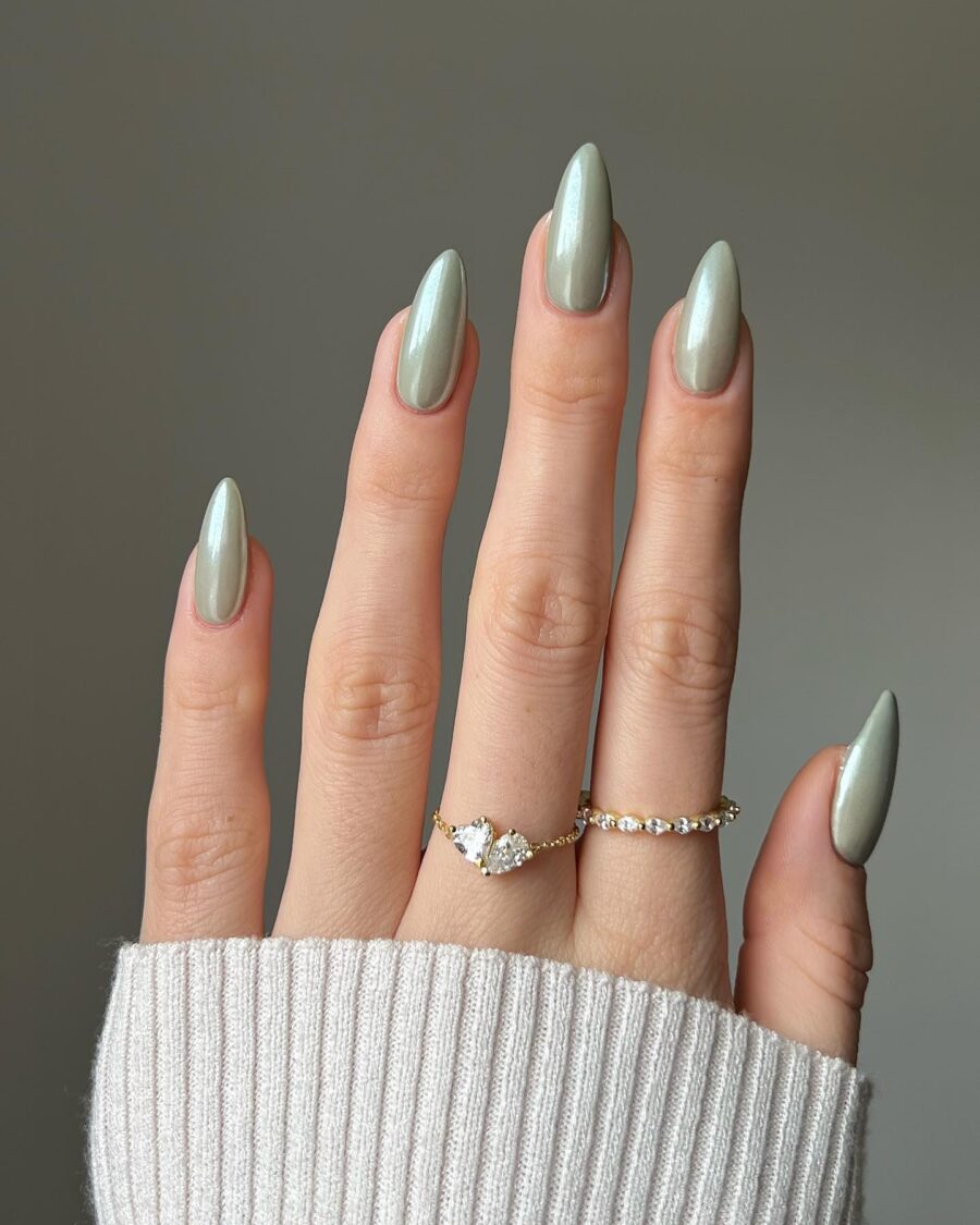Elegant long almond-shaped nails in soft green