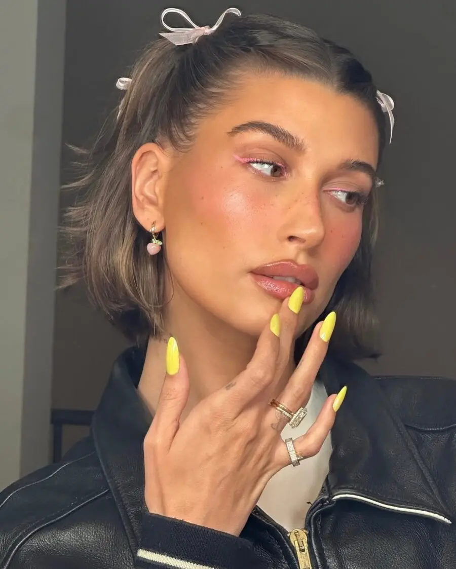Vibrant Yellow Glossy Nails with Edgy Style