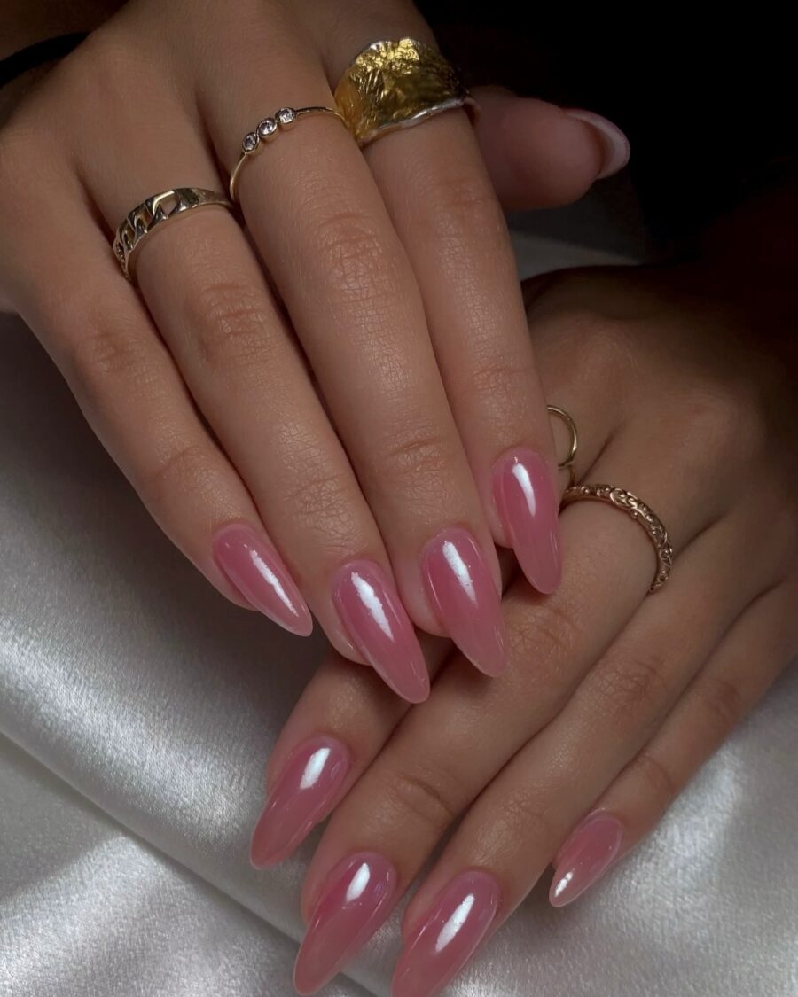 Elegant pink glossy stiletto nails with rings