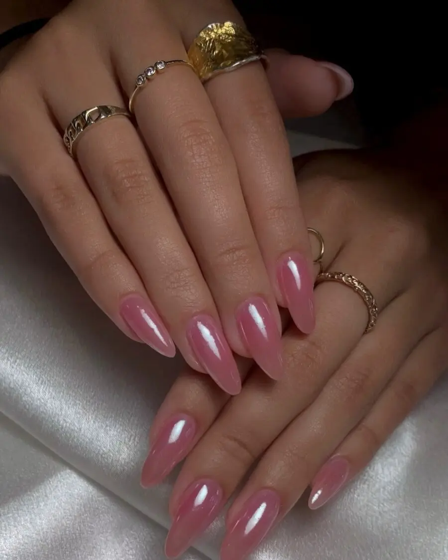 Elegant pink glossy stiletto nails with rings