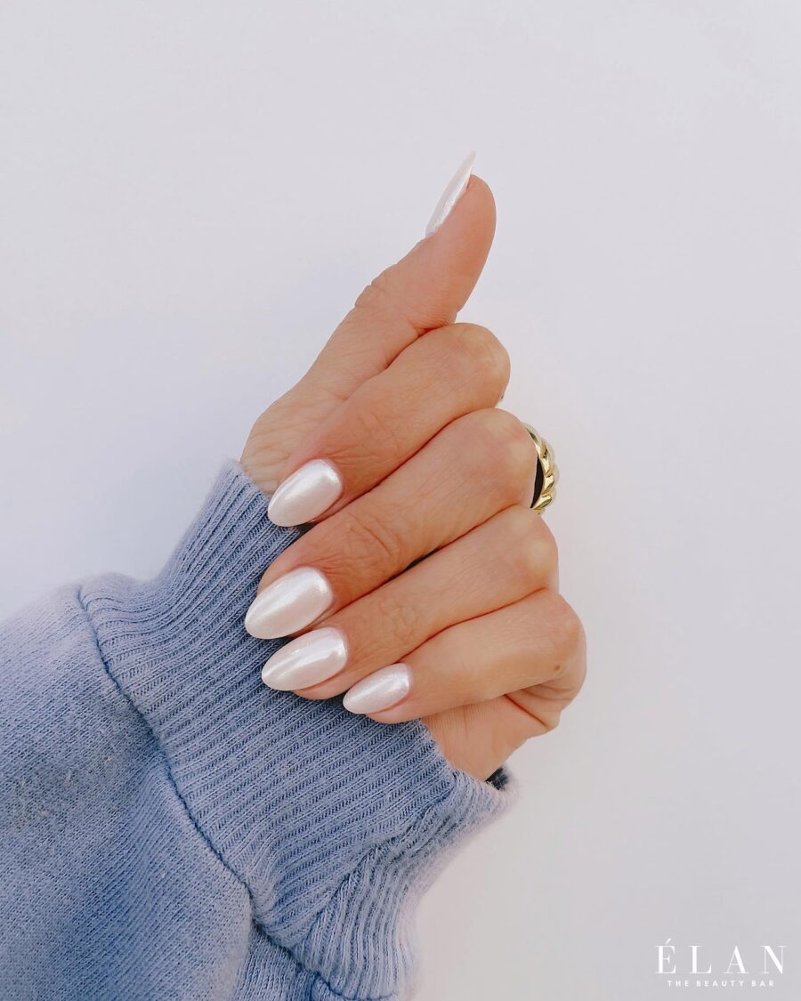 Elegant glossy white oval nails on display