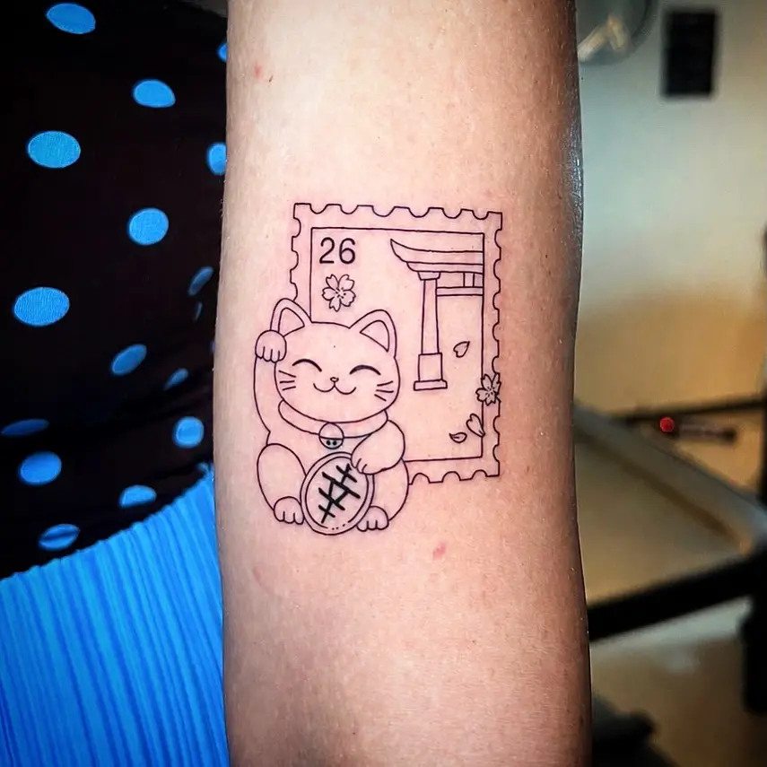 Charming Japanese cat tattoo with postage design