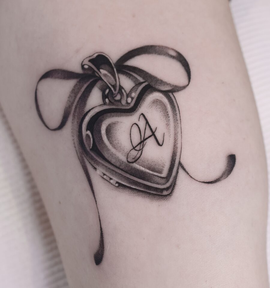 Elegant heart locket tattoo symbolizing cherished memories