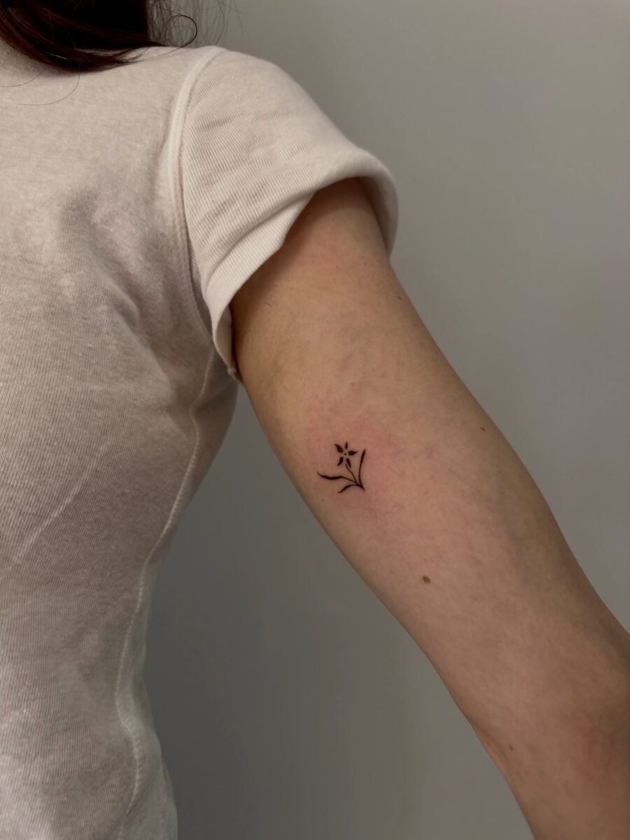 Delicate floral tattoo on the inner arm