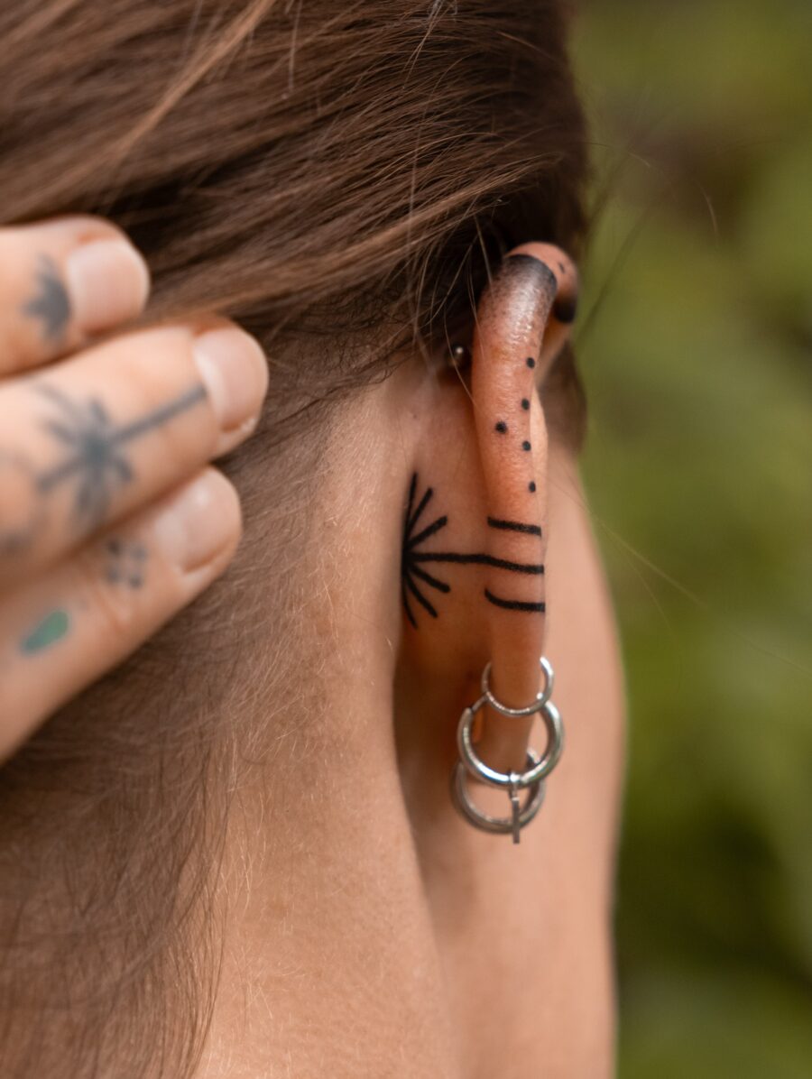 Elegant subtlety in ear tattoo designs