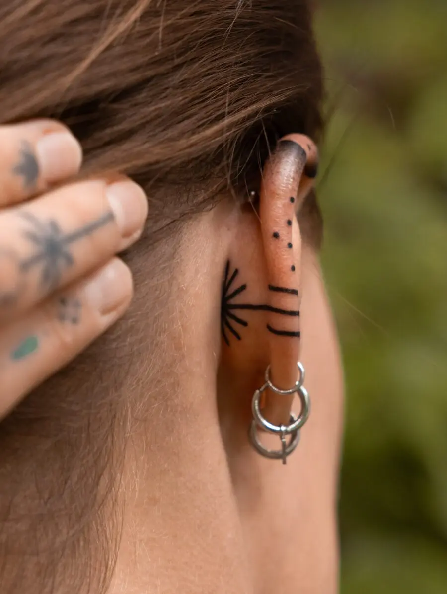 Elegant subtlety in ear tattoo designs