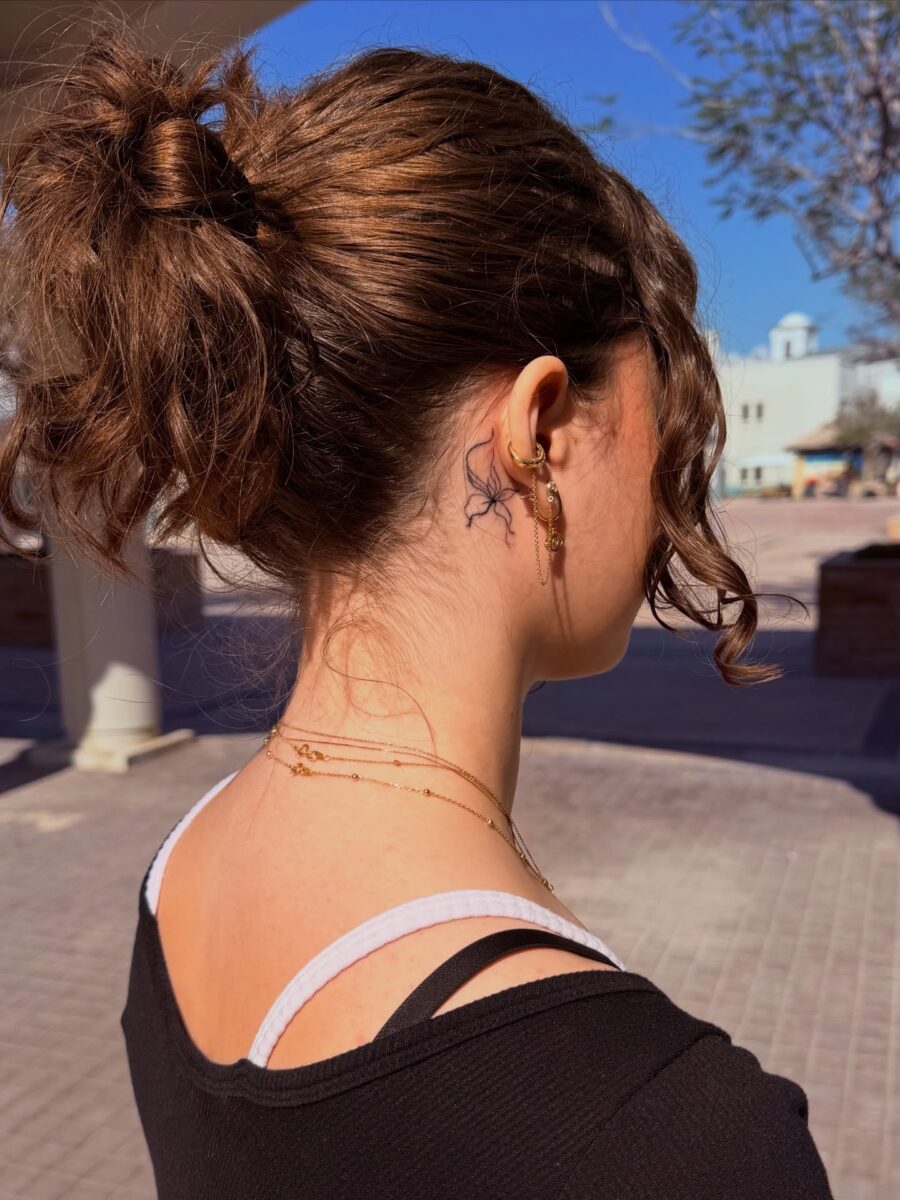 Elegant Hidden Tattoo on the Neck