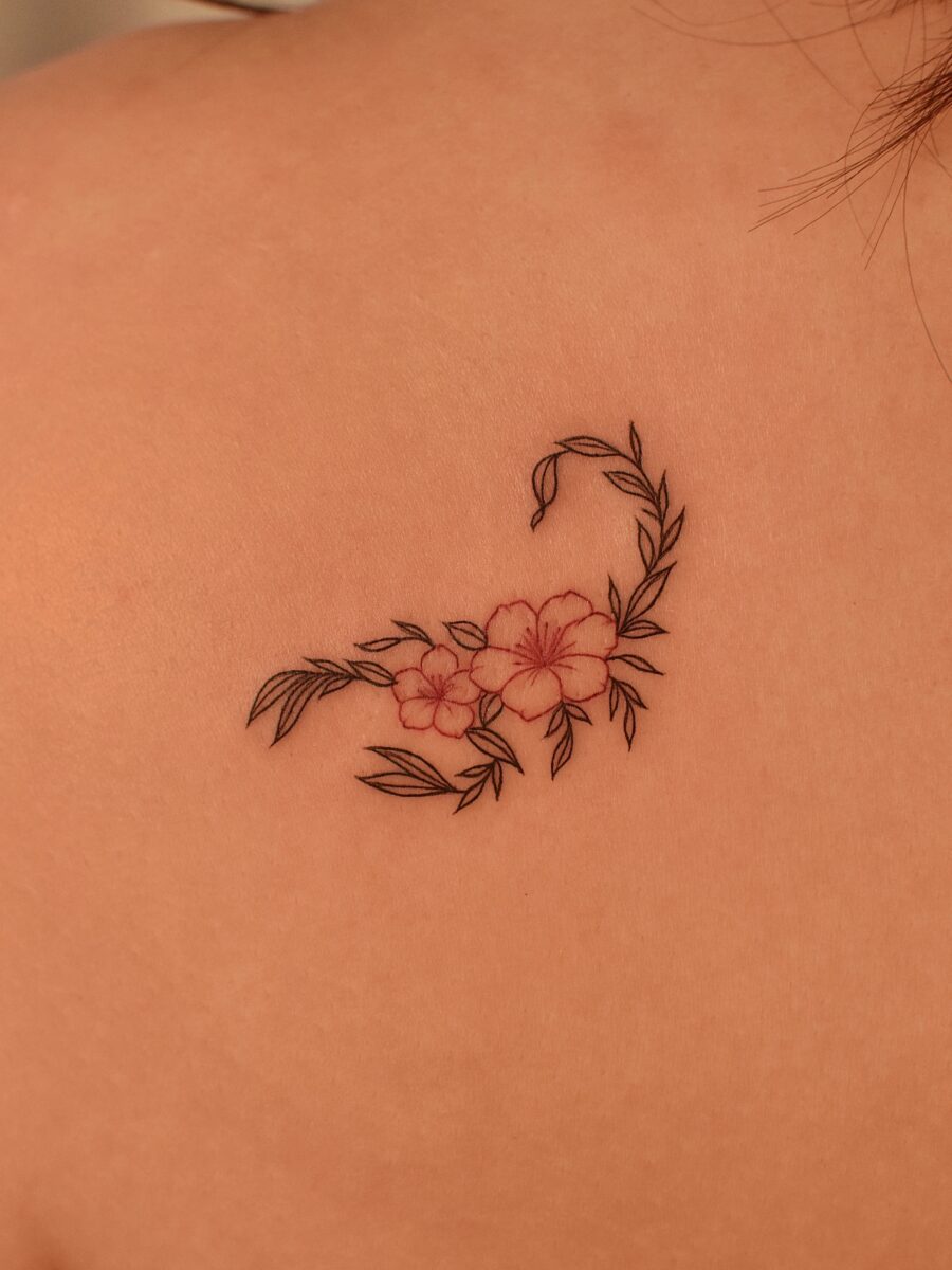 Elegant floral swan tattoo on the back