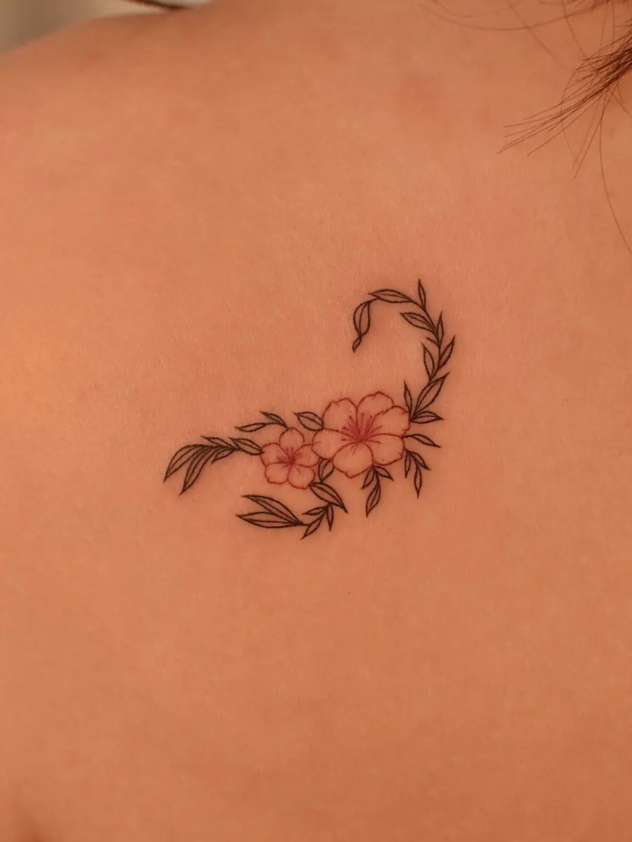 Elegant floral swan tattoo on the back