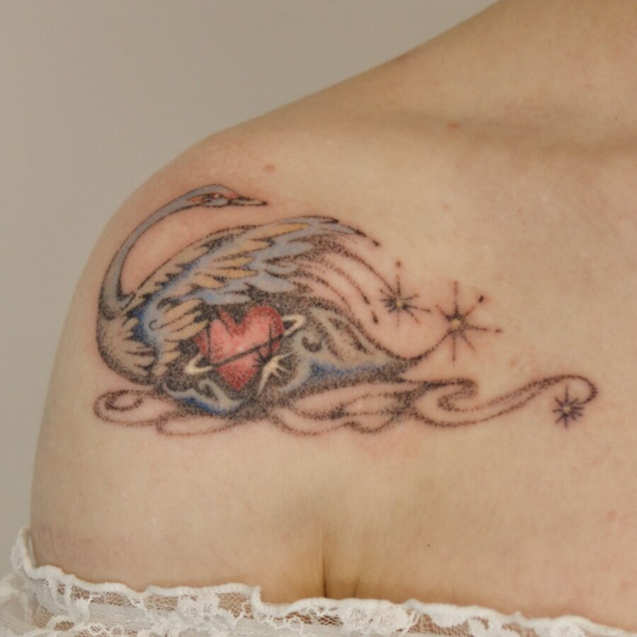 Elegant swan tattoo with heart and stars