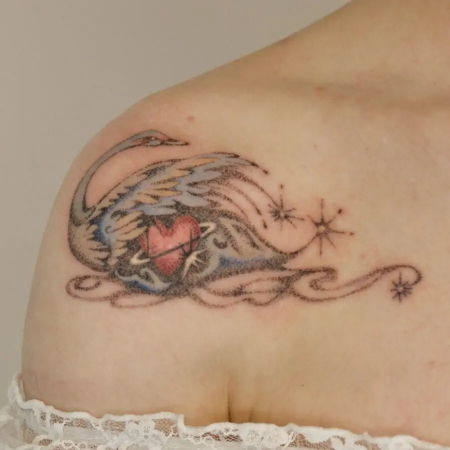 Elegant swan tattoo with heart and stars