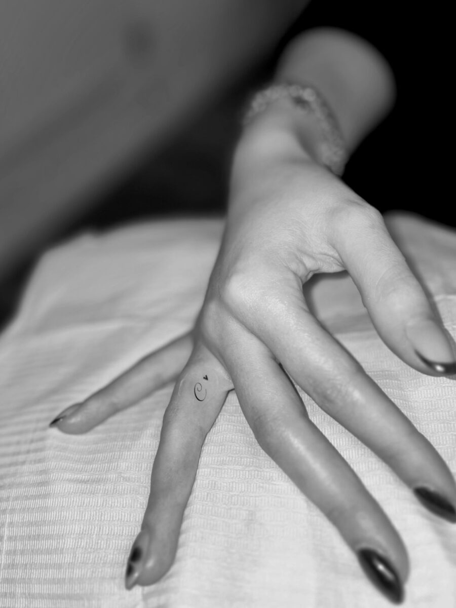 Subtle elegance with hidden finger tattoos
