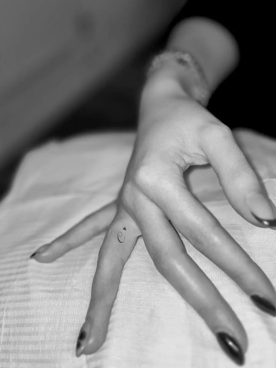 Subtle elegance with hidden finger tattoos