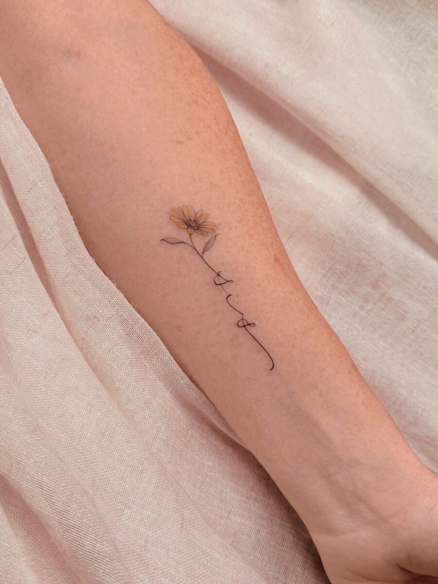 Delicate flower tattoo symbolizes cherished memories