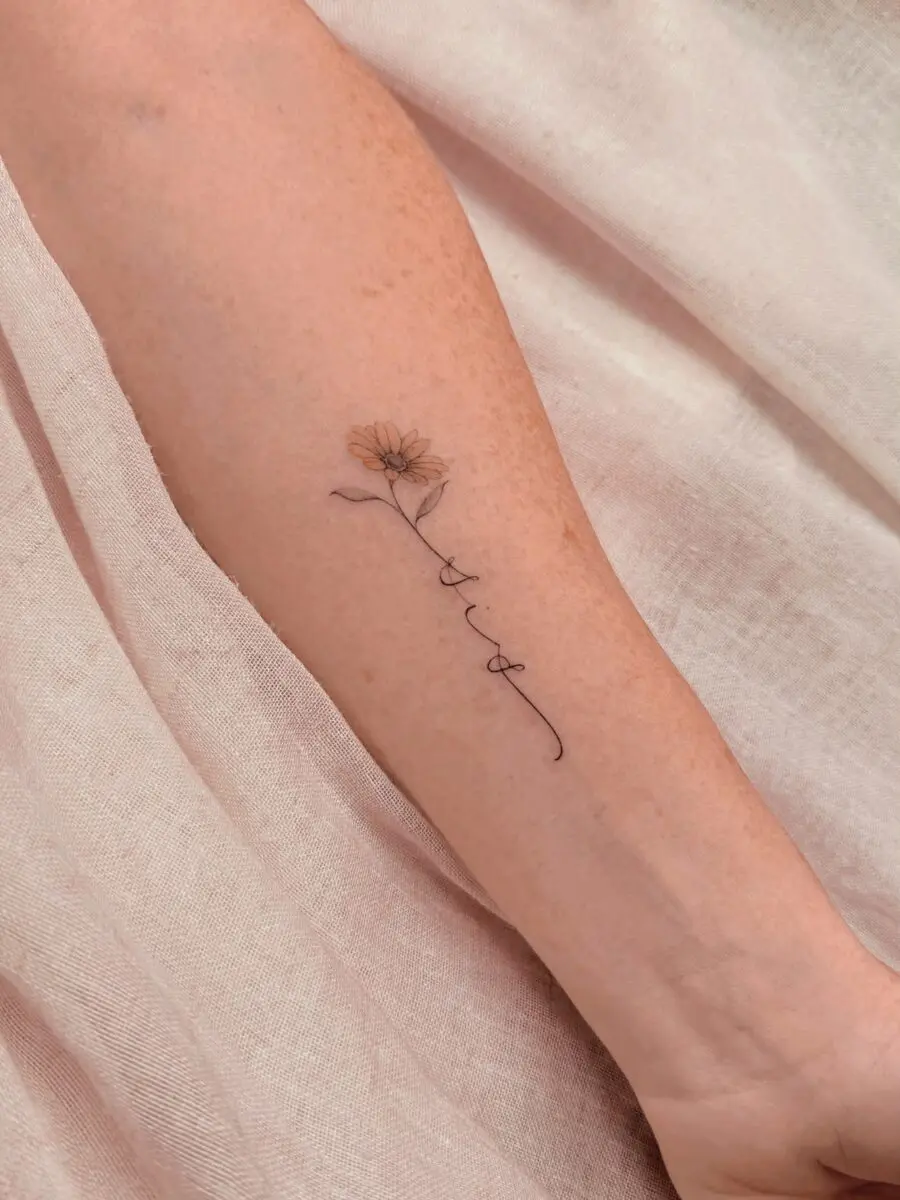 Delicate flower tattoo symbolizes cherished memories